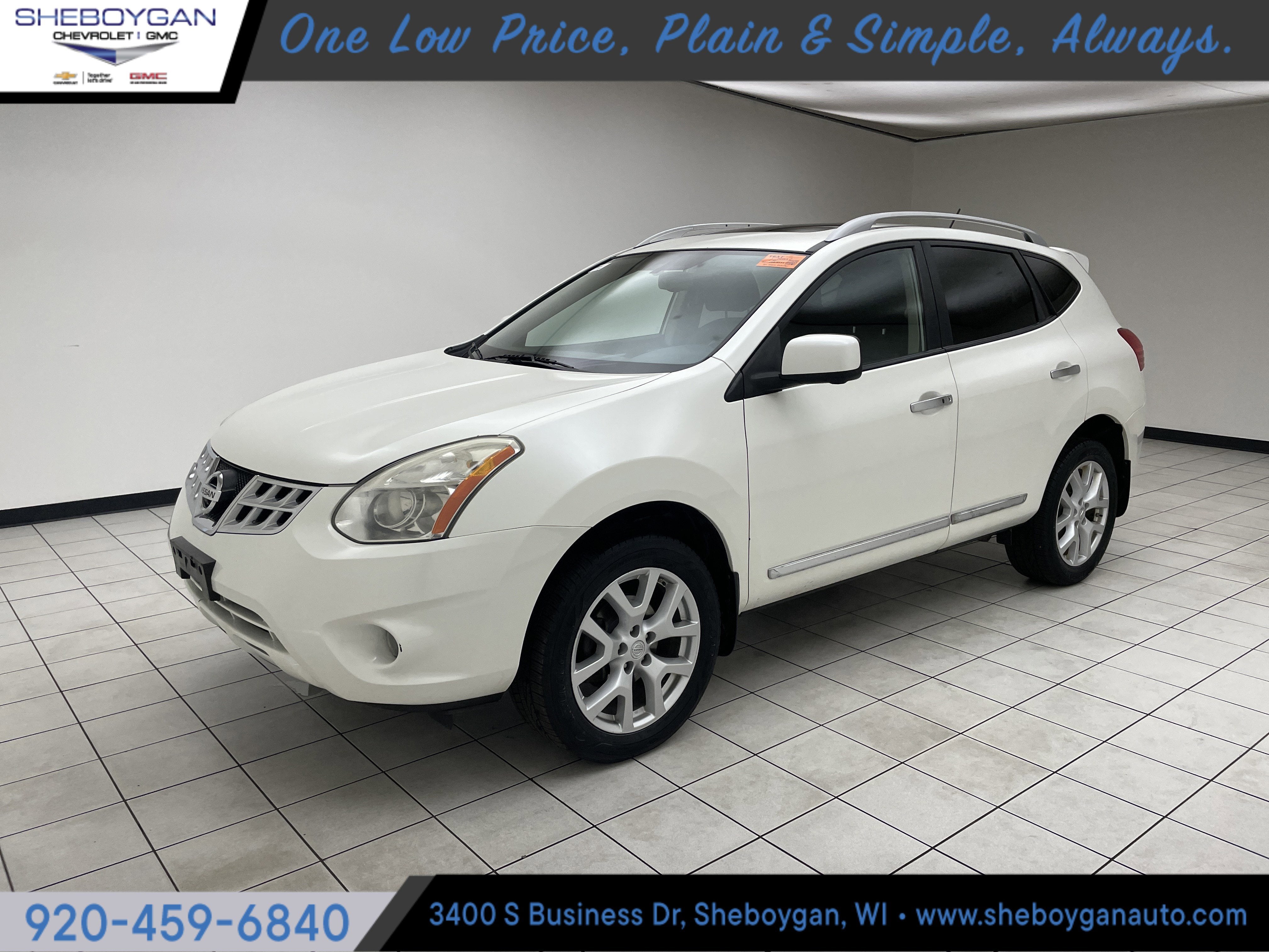 2013 Nissan Rogue SV w/SL Pkg in White — front three-quarter view