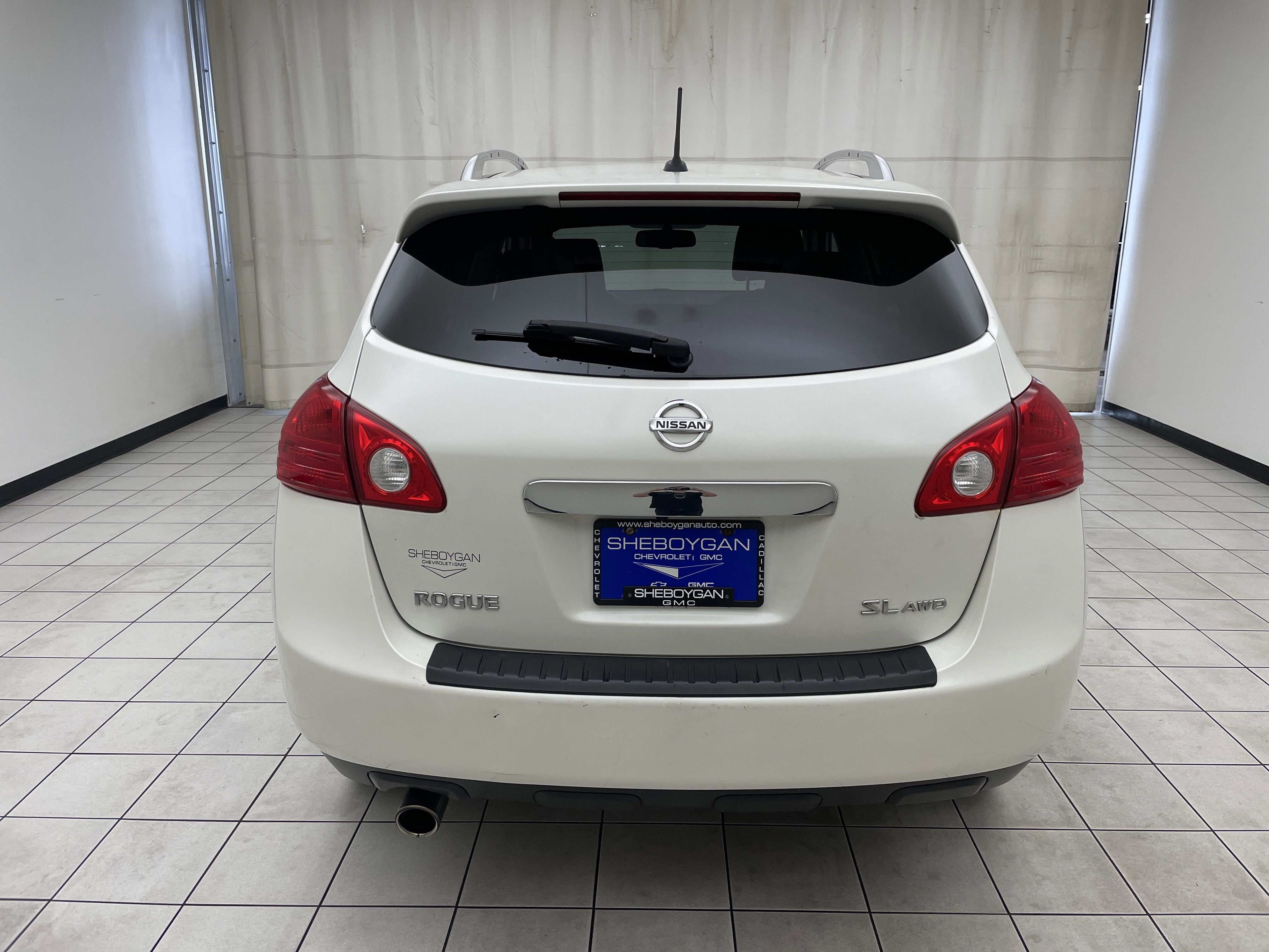 2013 Nissan Rogue — rear three-quarter view
