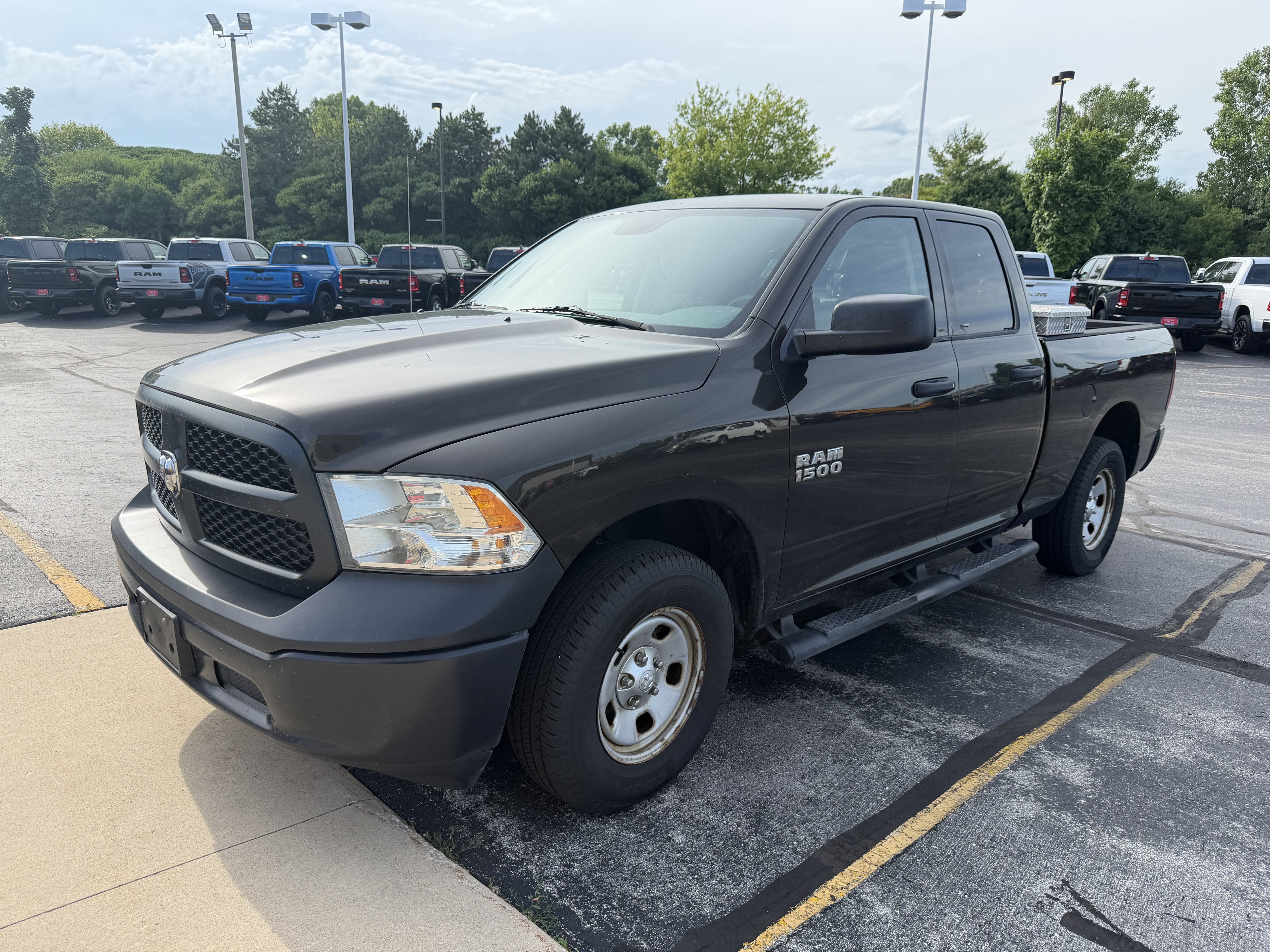 2014 RAM 1500 Tradesman in Black Gold Pearlcoat — front three-quarter view