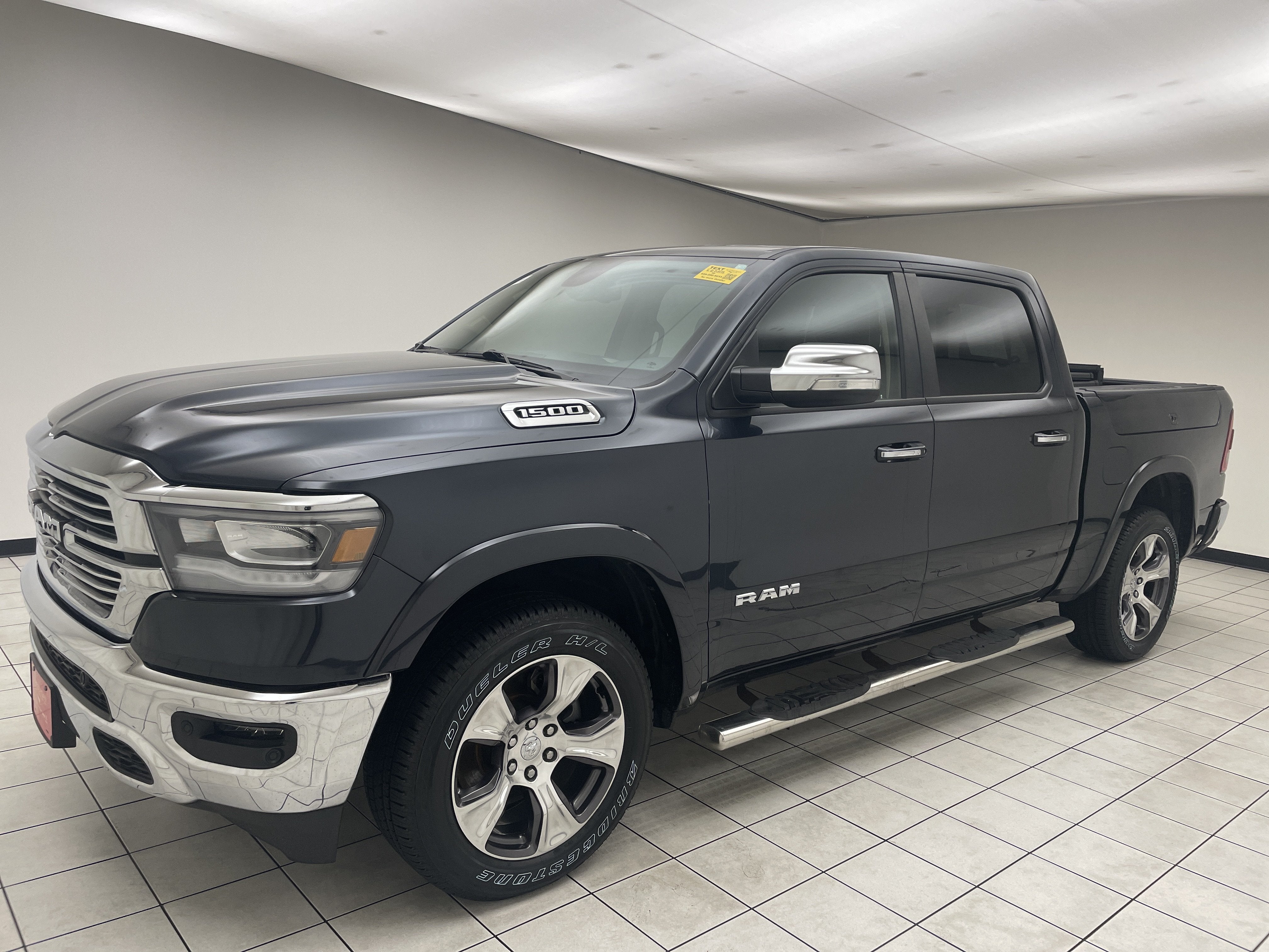 2019 RAM 1500 Laramie Crew Cab 4x4 5'7' Box in Maximum Steel Metallic Clearcoat — front three-quarter view