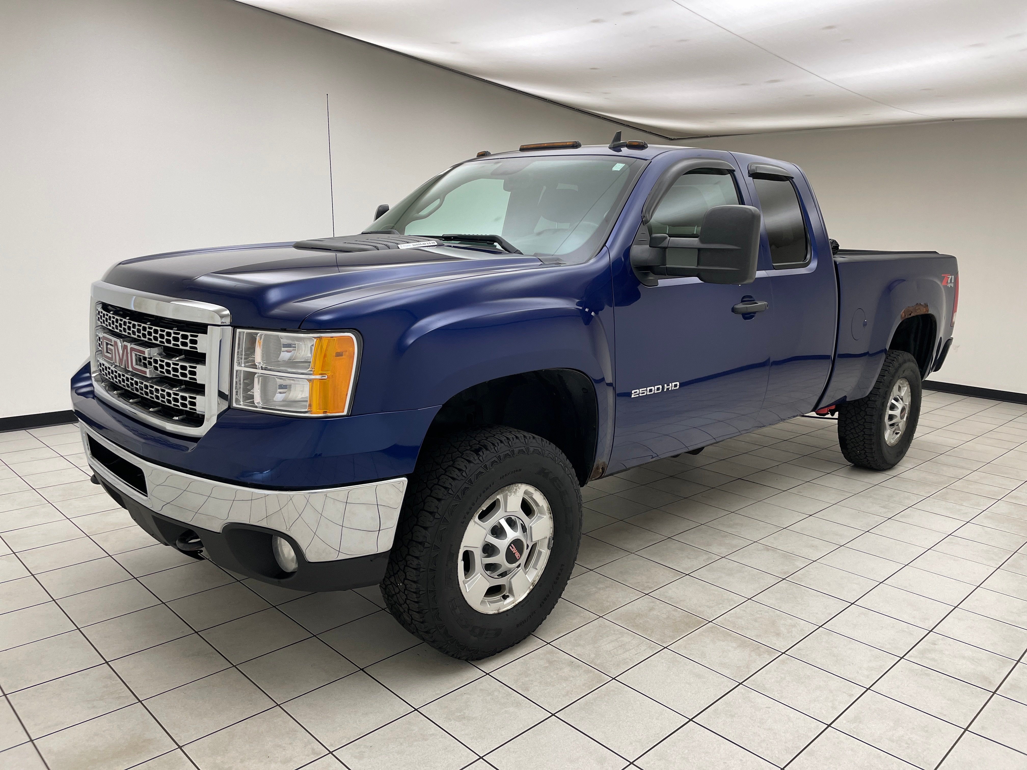 2013 GMC Sierra 2500HD SLE in Heritage Blue Metallic — front three-quarter view