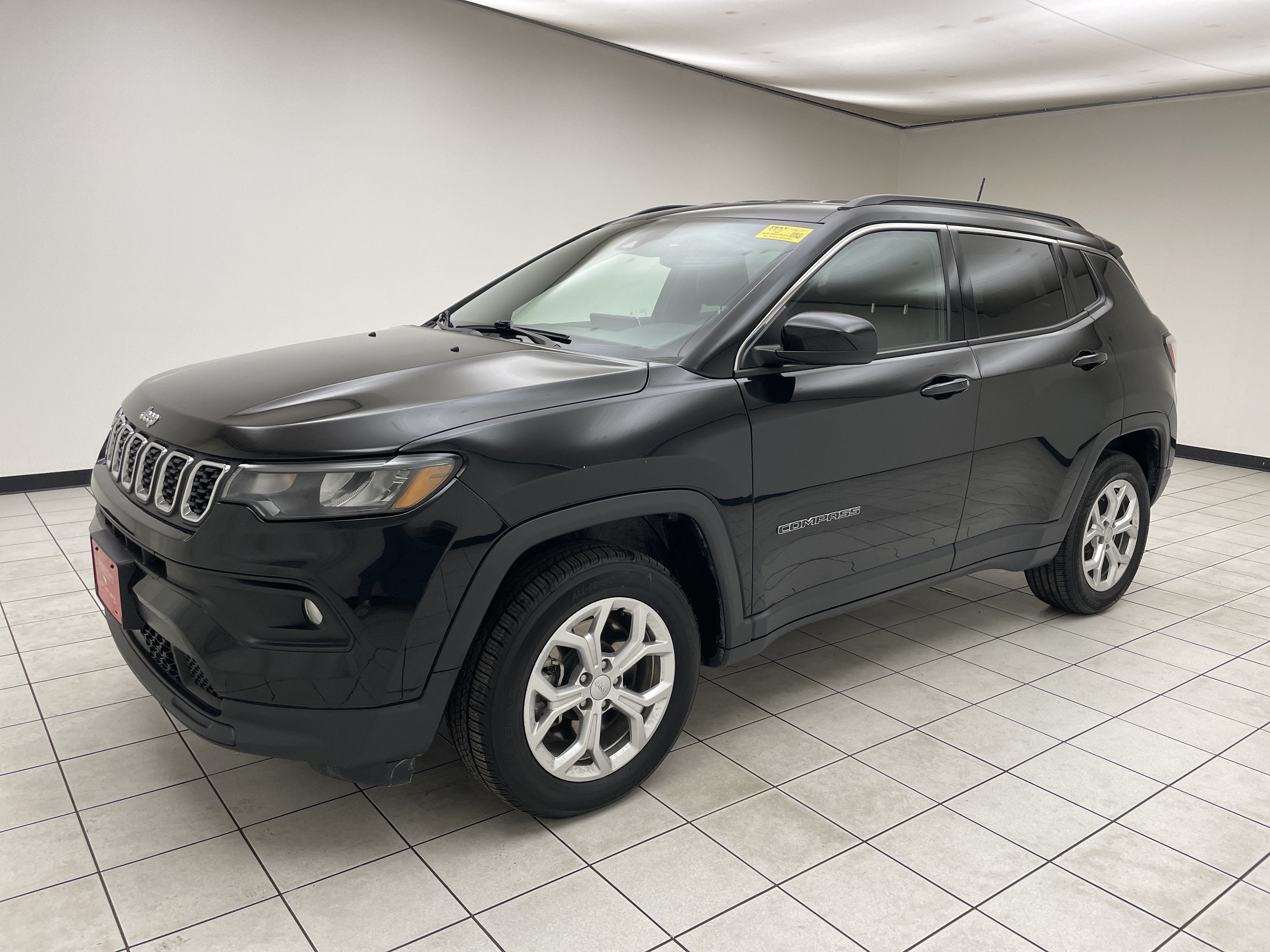 2024 Jeep Compass Latitude 4x4 in Diamond Black Crystal Pearlcoat — front three-quarter view